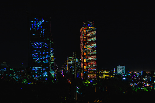 Shot of the area of the tallest skyscrapers in Mexico City on Paseo de la Reforma (Colonia Juarez), where the Angel of Independence, the Ritz Carlton, the Torre Mayor and the BBVA Tower are located. You can see the lights of some offices still on.