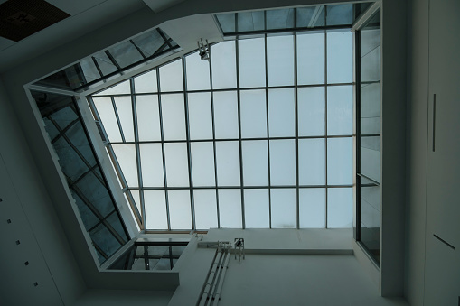 Brussels, Belgium - July 17, 2021: indoor plaza passage gallery with bent glaze domes where you find luxury shops. Glass dome heritage.