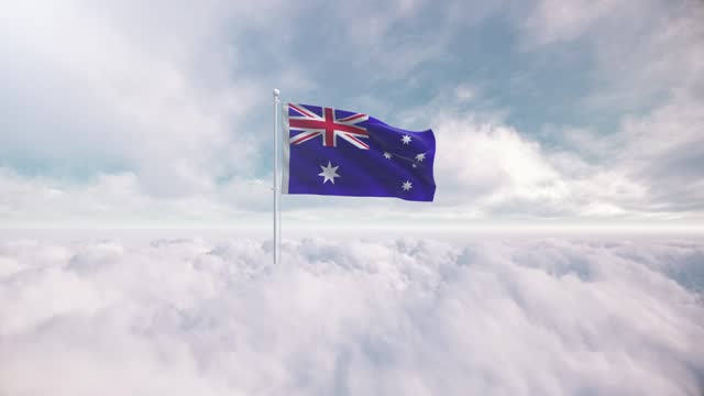 Australian flag rises above the clouds. The concept of liberty and patriotism, national flag waving proudly above the clouds, symbolizing freedom, independence day, celebration, freedom, patriotic, power and  freedom,