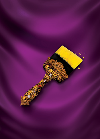 Created through photo manipulation and collage, an antique jeweled gold brush sparkles majestically on a silk backdrop. A beautiful paintbrush that references classic fashion and art.