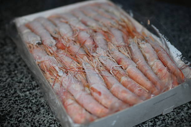 istock Red king frozen shrimp in a box 1912741736