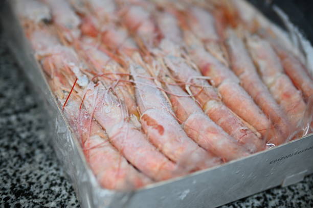 istock Red king frozen shrimp in a box 1912741743