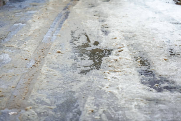 istock Melting snow on asphalt snow and dirt 1912770729