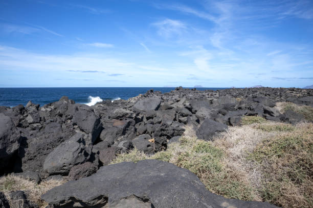 istock Volcanic rocks on the coast, Lanzarote, Spain 1912788854