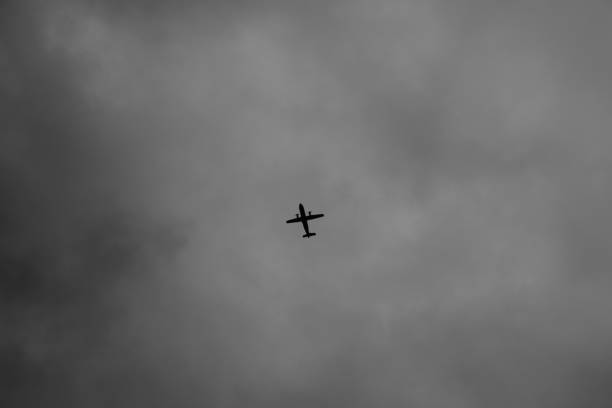 istock Flying plane in the cloudy sky 1912862356