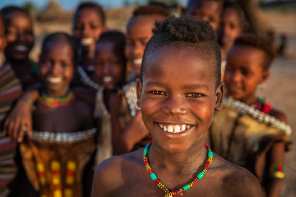 group of happy african children from hamer tribe, east africa - hamer ストックフォトと画像