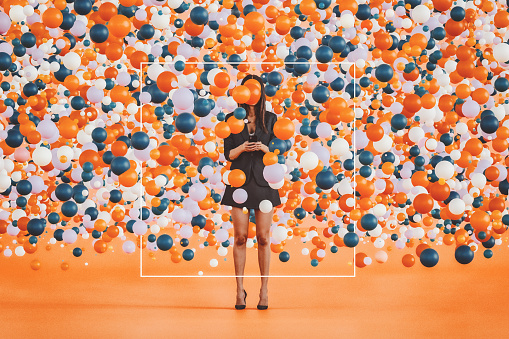 Abstract woman txt messaging surrounded with large group of balloons. 3D generated image.