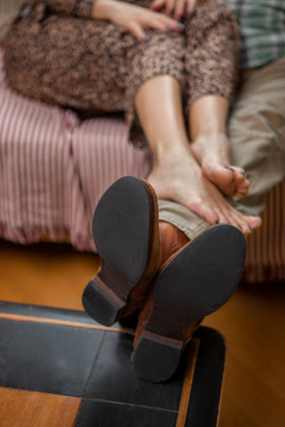 istock Married couple relaxing at home on the sofa 1912941470