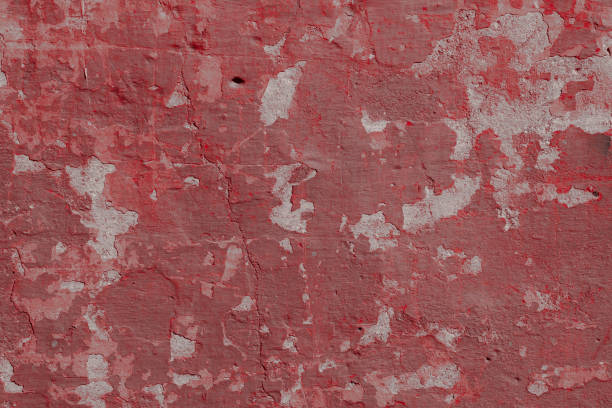 istock Scary red concrete wall with deep scratches and chips. Various variations of abrasions. 1912951448