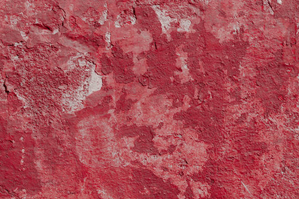 istock Scary red concrete wall with deep scratches and chips. Various variations of abrasions. 1912955601