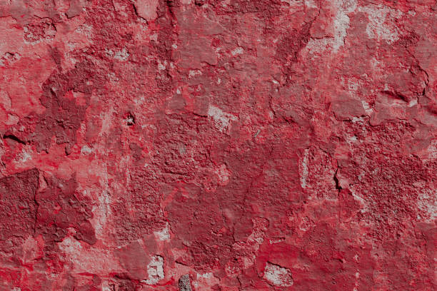 istock Scary red concrete wall with deep scratches and chips. Various variations of abrasions. 1912957209