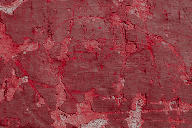 istock Scary red concrete wall with deep scratches and chips. Various variations of abrasions. 1912960387