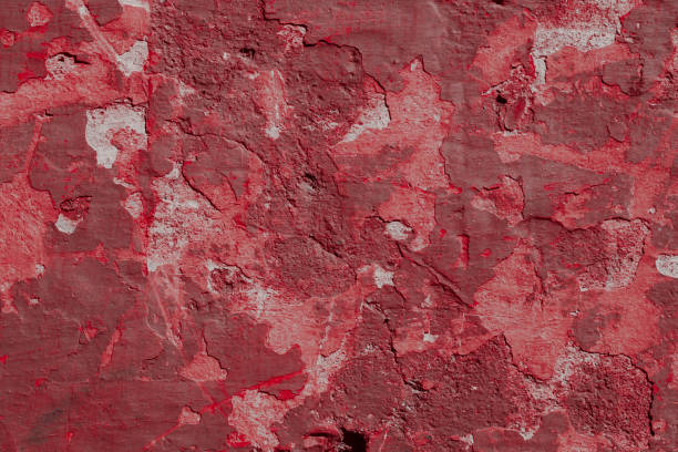 istock Scary red concrete wall with deep scratches and chips. Various variations of abrasions. 1912964027