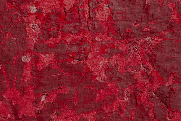 istock Scary red concrete wall with deep scratches and chips. Various variations of abrasions. 1912965605