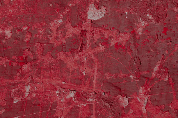 istock Scary red concrete wall with deep scratches and chips. Various variations of abrasions. 1912969191