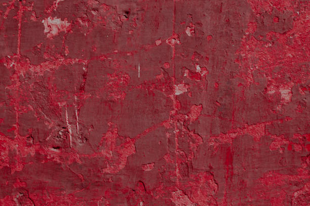 istock Scary red concrete wall with deep scratches and chips. Various variations of abrasions. 1912971527