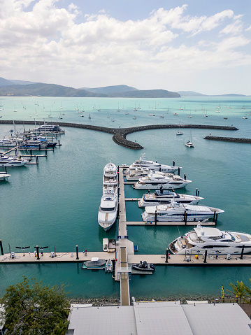 Bayfront homes and boats reflecting in the sun