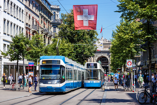 Zurich, Switzerland - August 10, 2023: Bahnhofstrasse with trams type Cobra-Tram and Bombardier Flexity public transport in the city of Zurich, Switzerland.