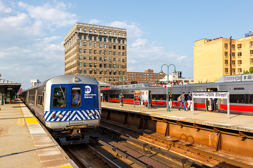 New York City, United States - May 11, 2023: Metro-North Railroad commuter train public transport at Harlem 125th Street railway station in New York, United States.