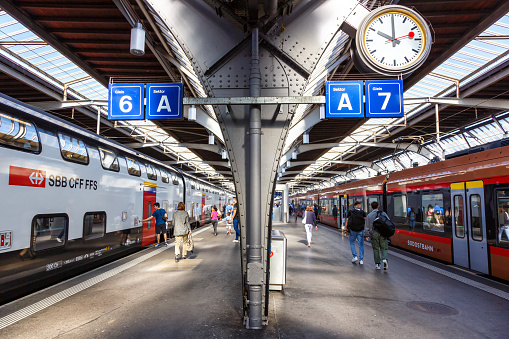 Zurich, Switzerland - August 10, 2023: Passenger trains of SBB Schweizerische Bundesbahnen and Südostbahn at main railway station in Zurich, Switzerland.