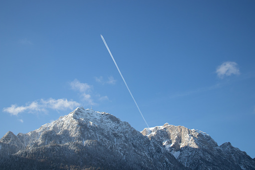 Bucegi Mountain from Romania covered by snow. Airplane flying above.Winter-time, cold