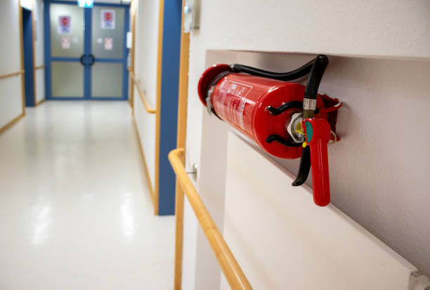 istock Fire extinguisher in the operating room. Red fire extinguisher tank in the laboratory. Fire safety system 1913023335
