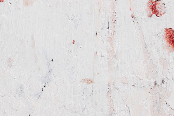 Free space for an inscription. Can be used as a background or poster. Fragment of a wall with bumps and peeling paint.