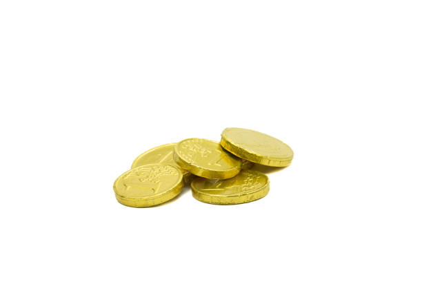 istock Stack of chocolate coins isolated on white background copy space group of golden chocolate coins money 1913063345