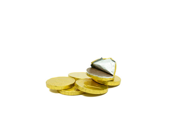 istock Stack of chocolate coins isolated on white background copy space group of golden chocolate coins money 1913066954