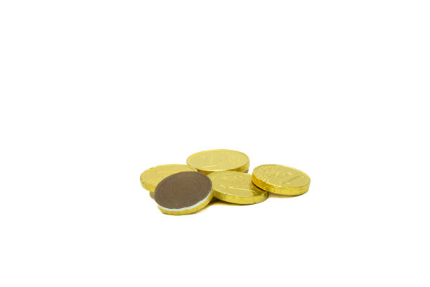 Stack of chocolate coins isolated on white background copy space group of golden chocolate coins money