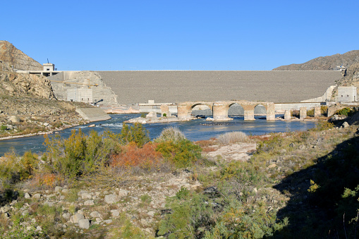 Khomarlu, Khoda Afarin County, East Azerbaijan province, Iran / Soltanly, Jabrayil District, Azerbaijan: Khudafarin Dam and the small / north Khoda Afarin / Khudafarin Bridge, across the Aras River in the Caucasus, the border between Iran and Azerbaijan. One of the two bridges, connecting the Iranian province of East Azerbaijan in the south and the Jebrayil Rayon of Azerbaijan in the north. The small bridge has eleven arches and was built in the 11th-12th centuries, only three arches remain intact, probably dates from the  Safavid era (1501–1736).