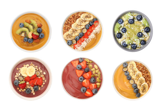 istock Set of different smoothie bowls isolated on white, top view 1913146362