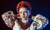 Charming ginger woman, traditional ukrainian style costume. Folk, ethnic culture