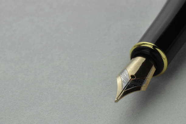 istock Stylish fountain pen on light grey table, closeup. Space for text 1913175180