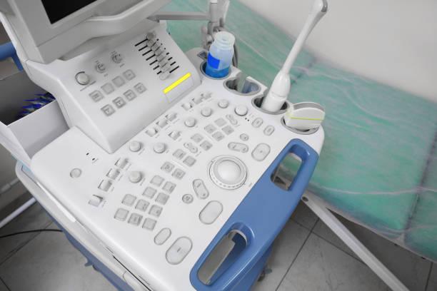 Ultrasound control panel and examination table in hospital, closeup