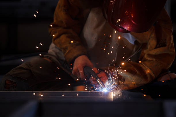 istock Welder welding a metal pipe. 1913224319