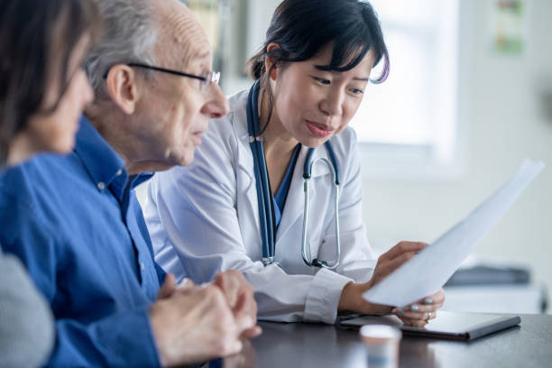 istock Senior Couple Medical Appointment 1913236417