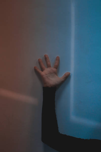 istock Female hand on the wall, lines geometry, form 1913271696