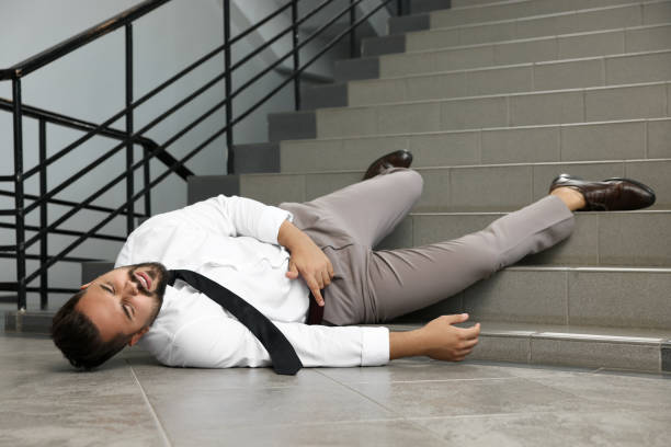 istock Man fallen down stairs suffering from pain indoors, space for text 1913334300