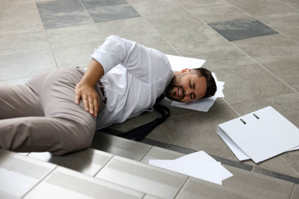 istock Man fallen down stairs suffering from pain indoors 1913338889