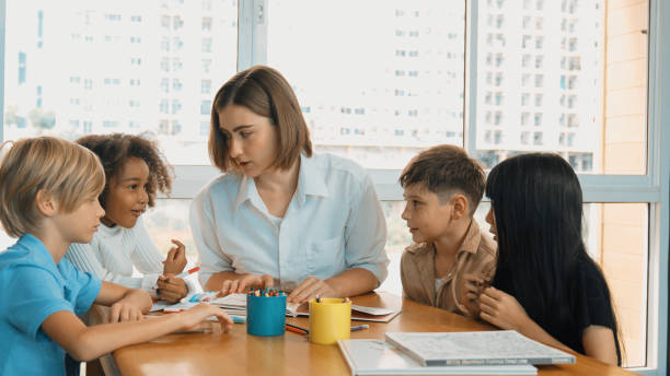 istock Happy student and smart teacher drawing and coloring by using marker. Erudition. 1913364020