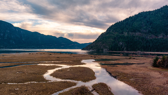 Howe Sound with Canadian Mountain Landscape Nature Aerial Background. Cloudy Sunset. Squamish, BC, Canada.