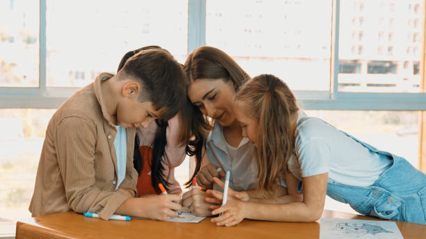 istock Happy student and smart teacher drawing and coloring by using marker. Erudition. 1913386635