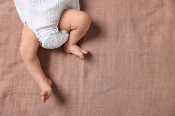 istock Newborn baby lying on blanket, top view. Space for text 1913396996