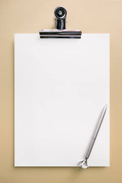 istock Clipboard neck-up. Business desk with table clock 1913672335