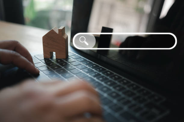 istock Man use computer to search data on internet, finding on website online. Concept of mortgage 1913672950