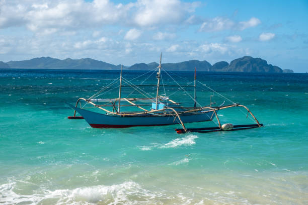 Small boat near a tropical beach in the Pacific
