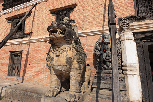 old stone statue of Guard dog in Bhaktapur durbar square, nepal