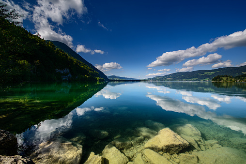 Lake Teletskoye with calm water on a summer day