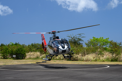 Triolet, Mauritius - October 25 2023: Corail Helicopteres Private Panoramic Flight Helicopter Landing at the Helipad